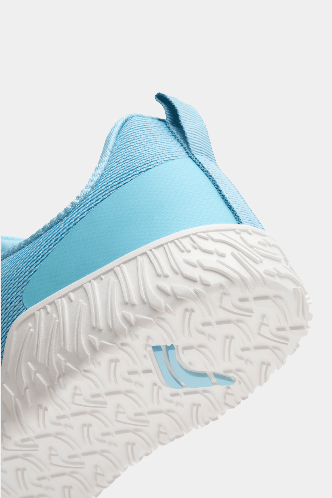 Blue sneaker with white sole on a light gray background for powerlifting