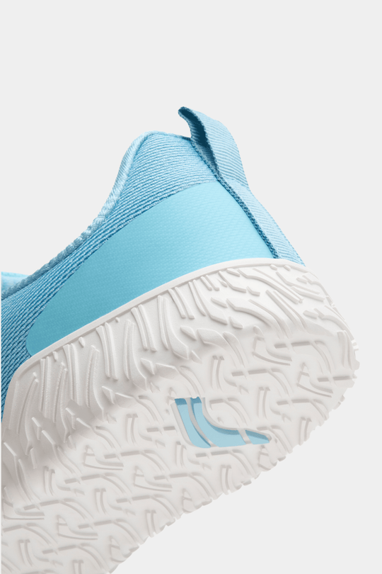 Blue sneaker with white sole on a light gray background for powerlifting