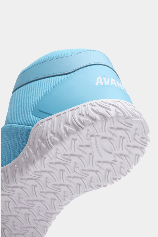 Close-up of a blue shoe with white sole on a light gray background for powerlifting