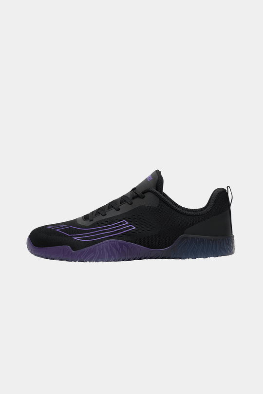 Black and purple athletic shoe on a white background